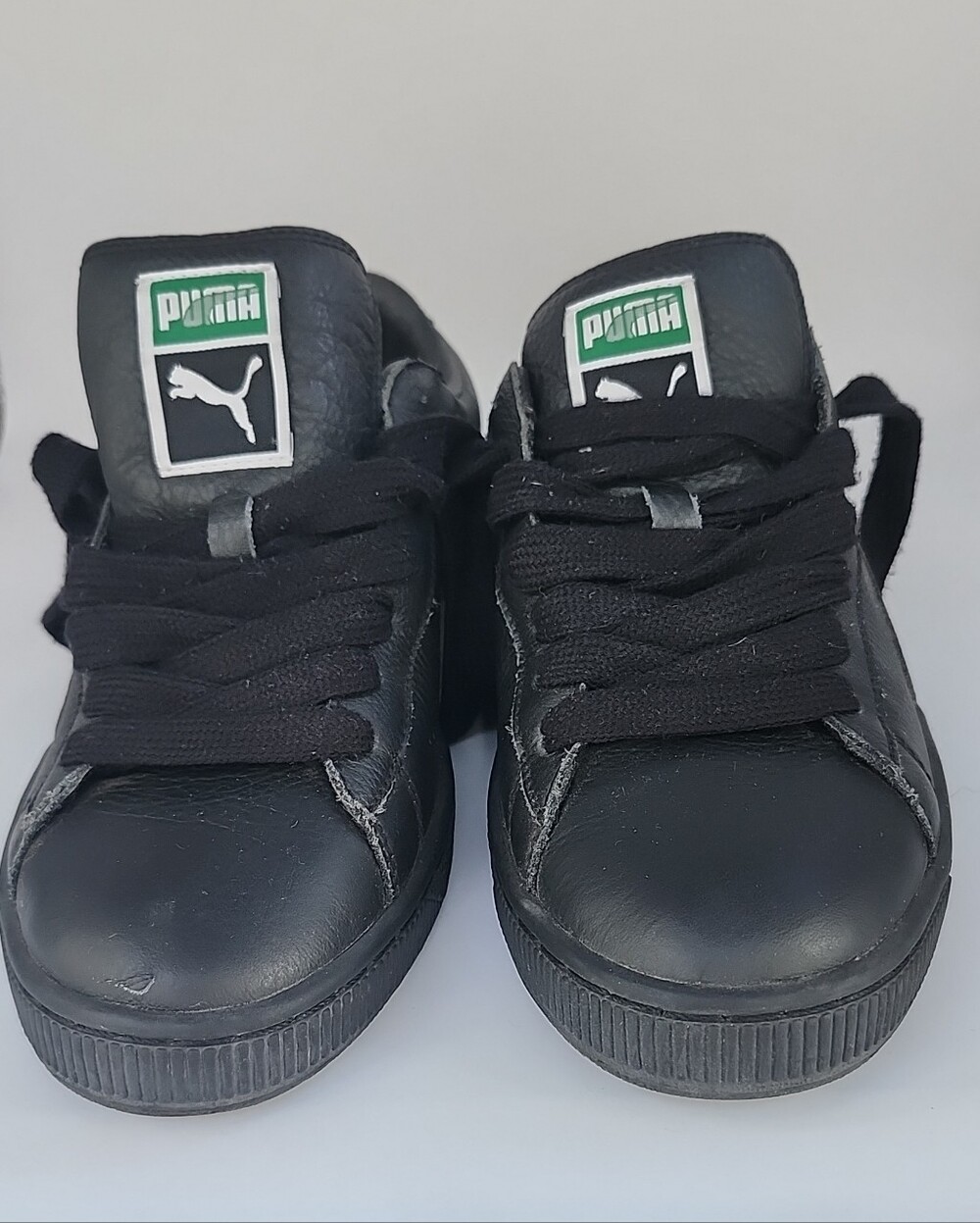 Puma Black Sneakers with Gold Logo